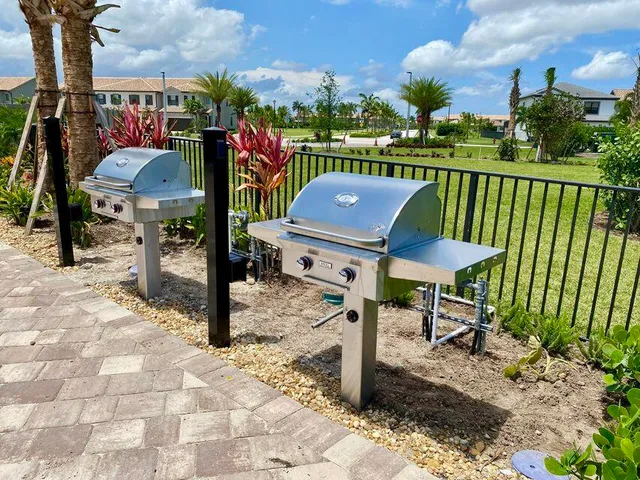a view of a chairs and table in backyard