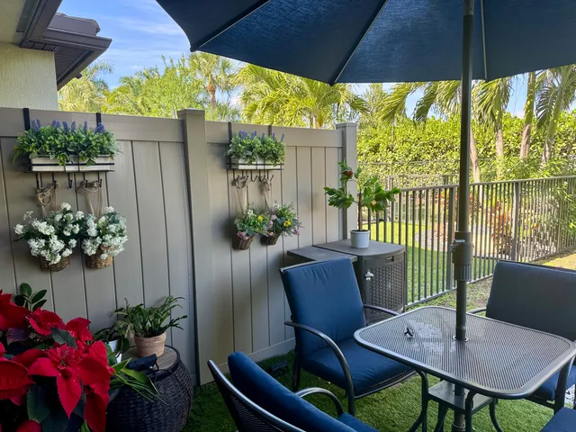 a view of a chairs and table in the patio