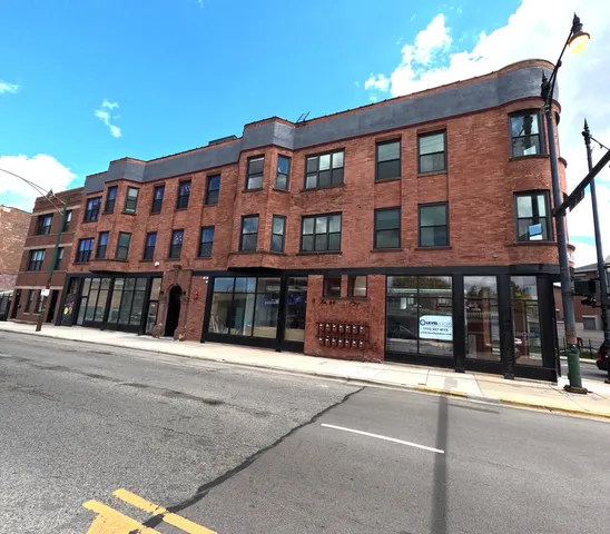 a front view of a building with a street