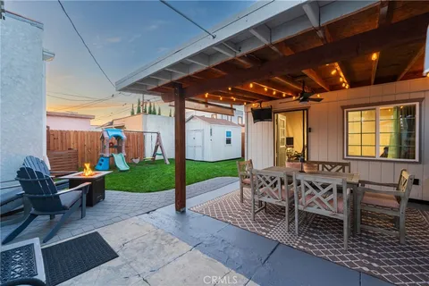 a patio with a table and chairs