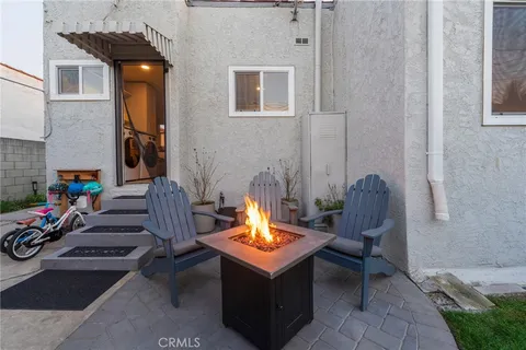 a view of a chairs and table in a patio
