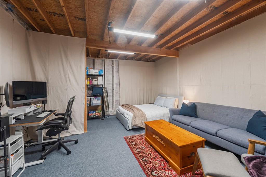 1931 West 68th Street Los Angeles, CA 90047 - Photo 24 of 29 a living room with furniture a flat screen tv and a window