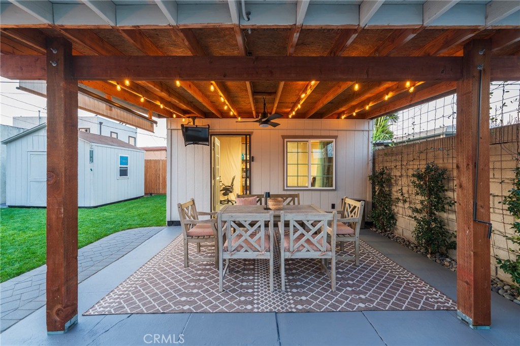 1931 West 68th Street Los Angeles, CA 90047 - Photo 6 of 29 a view of a patio with table and chairs and potted plants