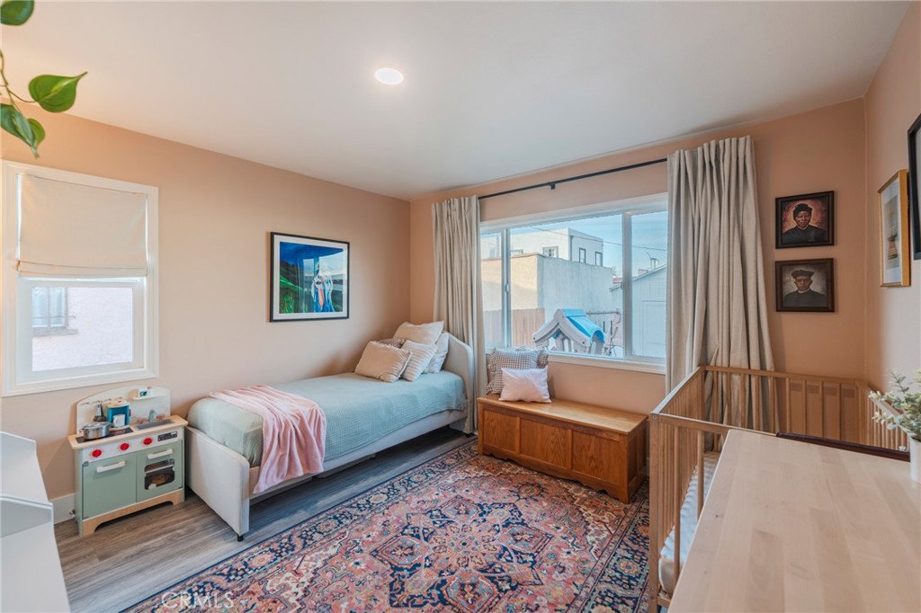 1931 West 68th Street Los Angeles, CA 90047 - Photo 9 of 29 a bedroom with a bed and a couch