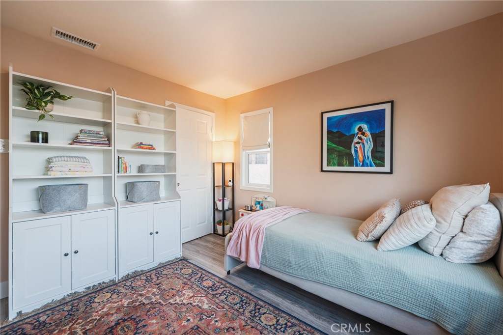 1931 West 68th Street Los Angeles, CA 90047 - Photo 10 of 29 a bedroom with a bed and a cabinets