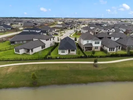 an aerial view of a house with a swimming pool