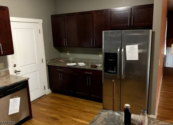 a kitchen with a sink and a refrigerator