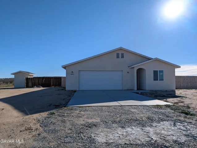 a kitchen with kitchen island sink and window