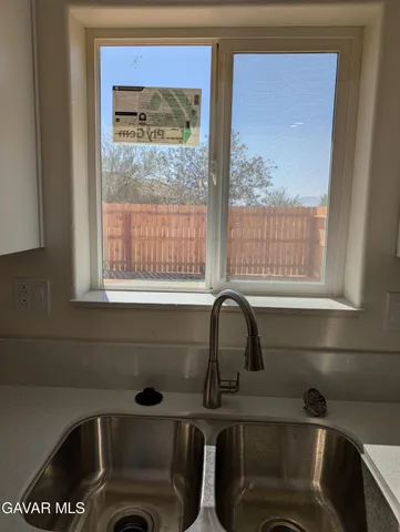 a bathroom with a bathtub and a sink