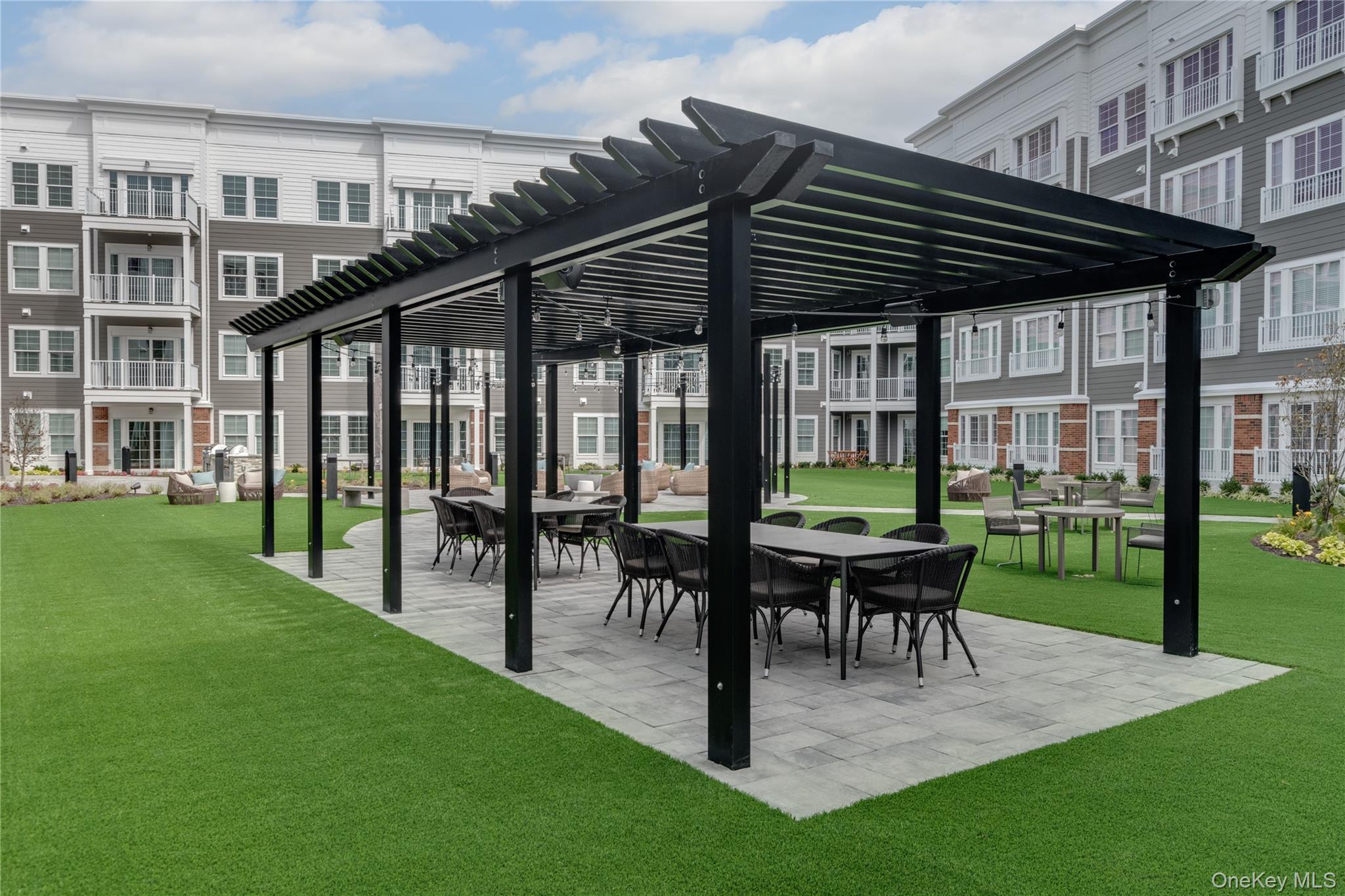 75 East Hoffman Avenue, Unit 2002 Lindenhurst, NY 11757 - Photo 7 of 8 a view of a house with backyard and sitting area