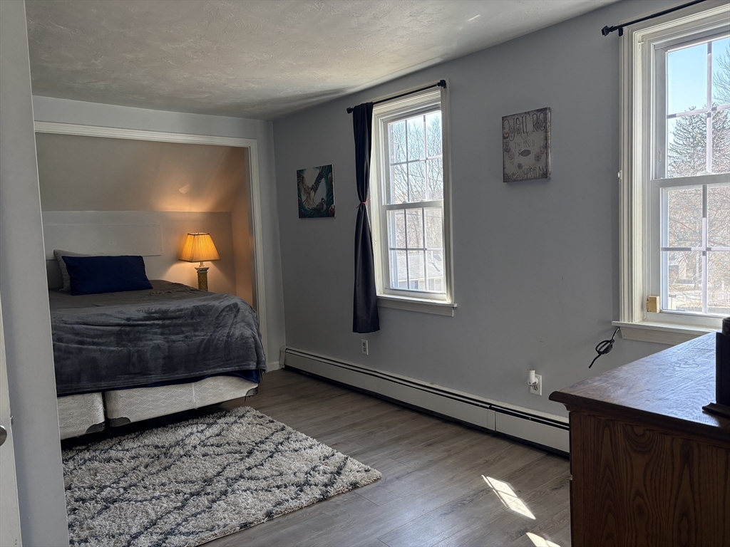 227 Union Street Northbridge, MA 01588 - Photo 15 of 21 a living room with a couch and a window