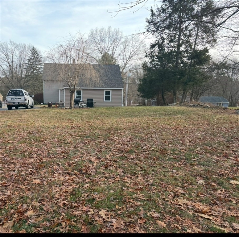 227 Union Street Northbridge, MA 01588 - Photo 4 of 21 a brick house with a yard