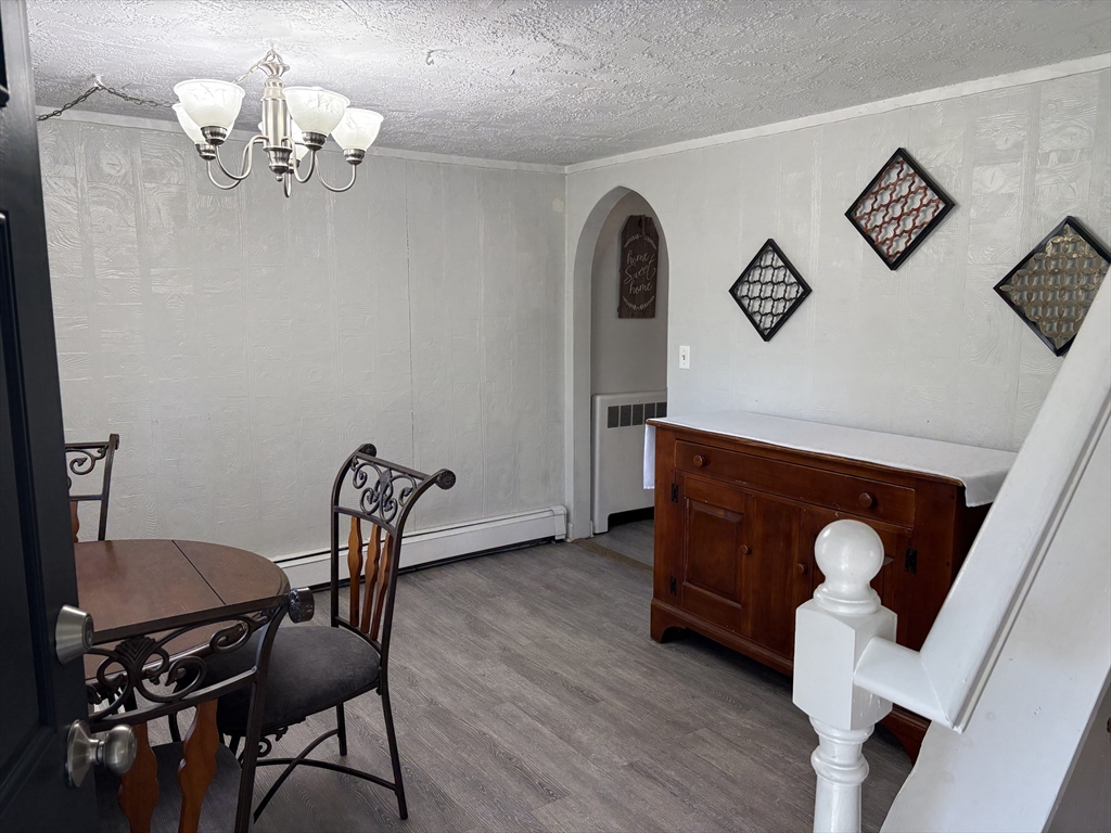 227 Union Street Northbridge, MA 01588 - Photo 9 of 21 a view of a dining room with furniture and wooden floor