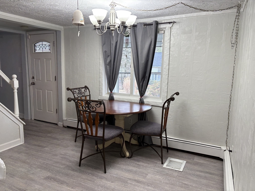 227 Union Street Northbridge, MA 01588 - Photo 10 of 21 a view of a dining room with furniture window and wooden floor