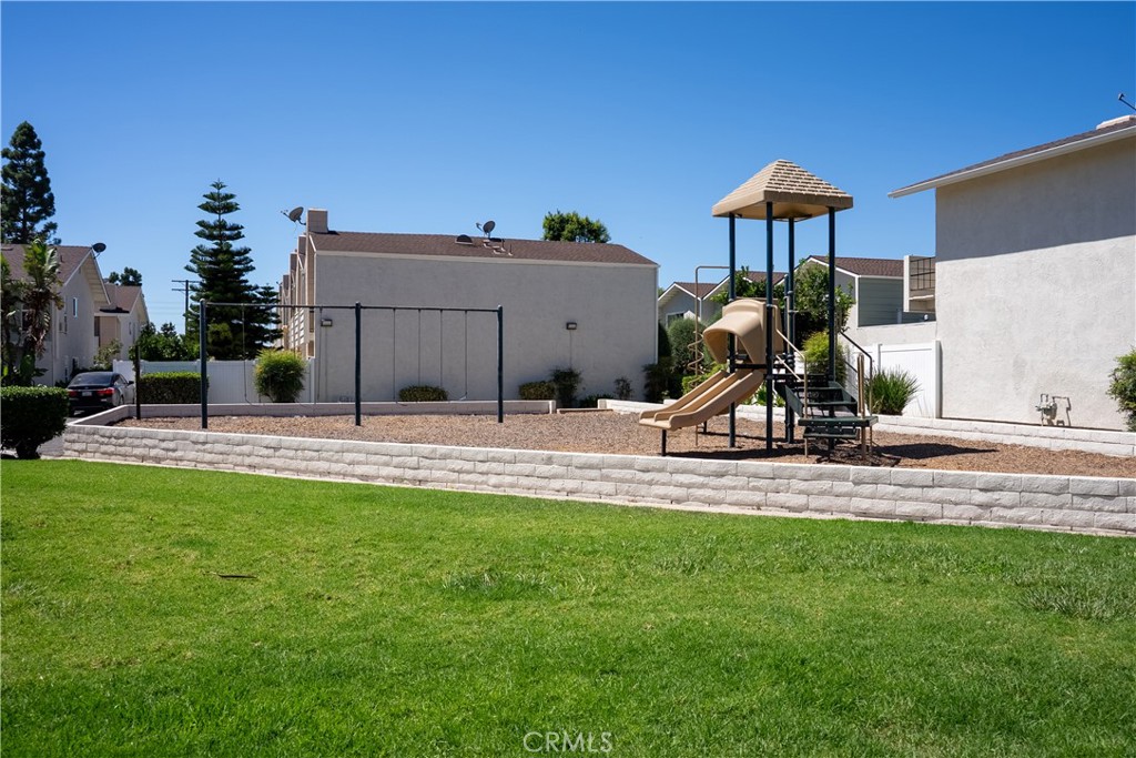 1192 Mitchell Avenue, Unit 3 Tustin, CA 92780 - Photo 25 of 30 a house view with a garden space