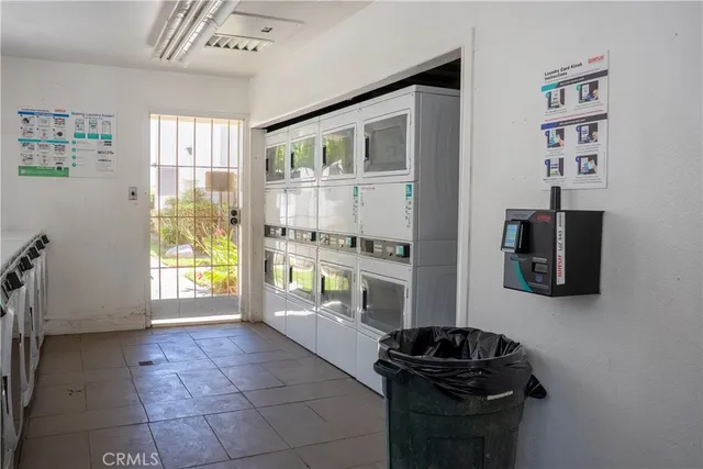 a kitchen with a refrigerator and a stove