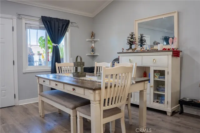 a dining room with furniture and window