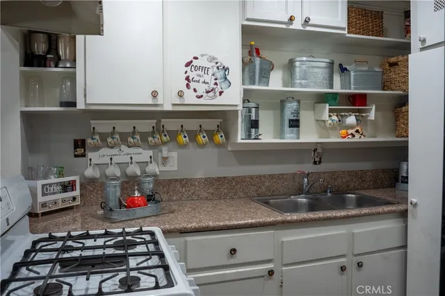 a kitchen with a stove and cabinets