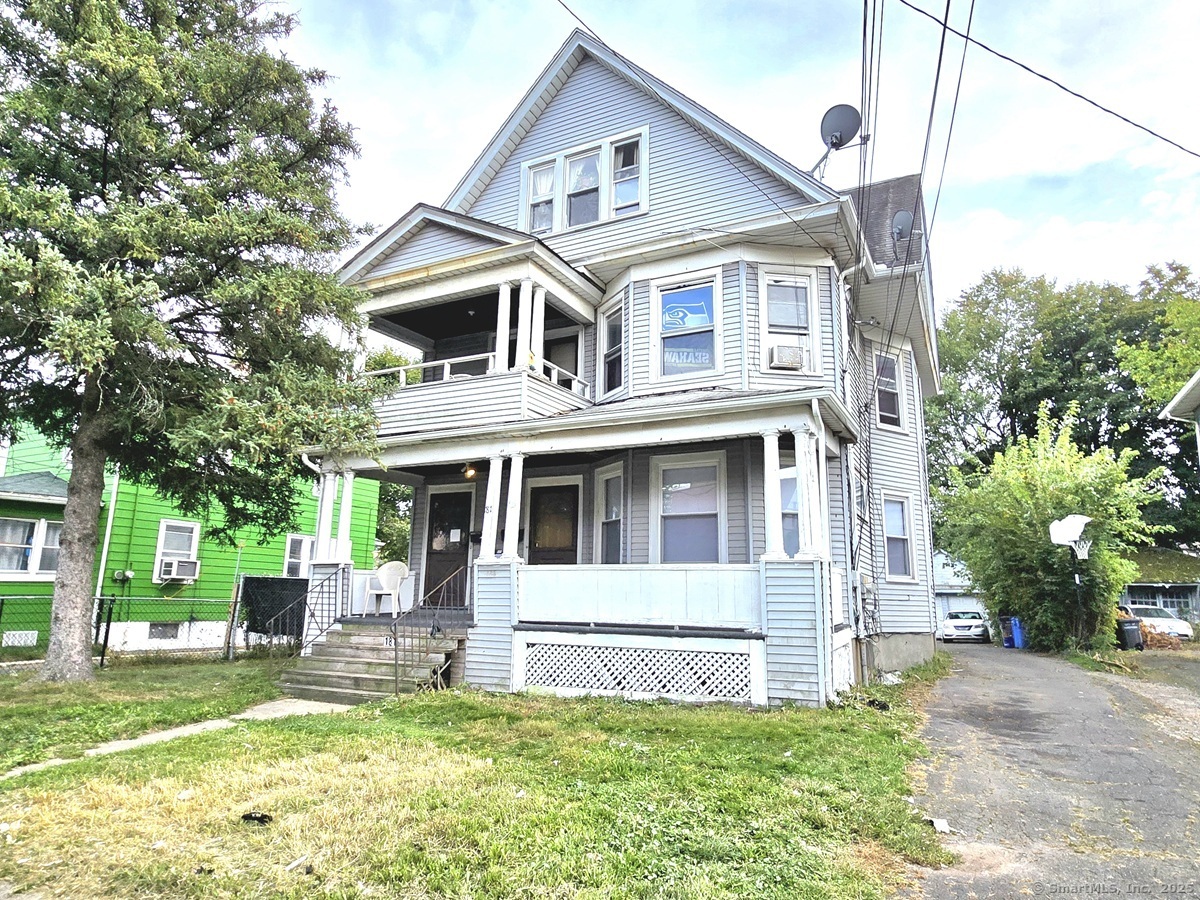 181 Bond Street, Unit 1 Hartford, CT 06114 - Photo 1 of 12 a front view of a house with a yard