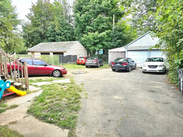 a view of a cars parked in front of a house