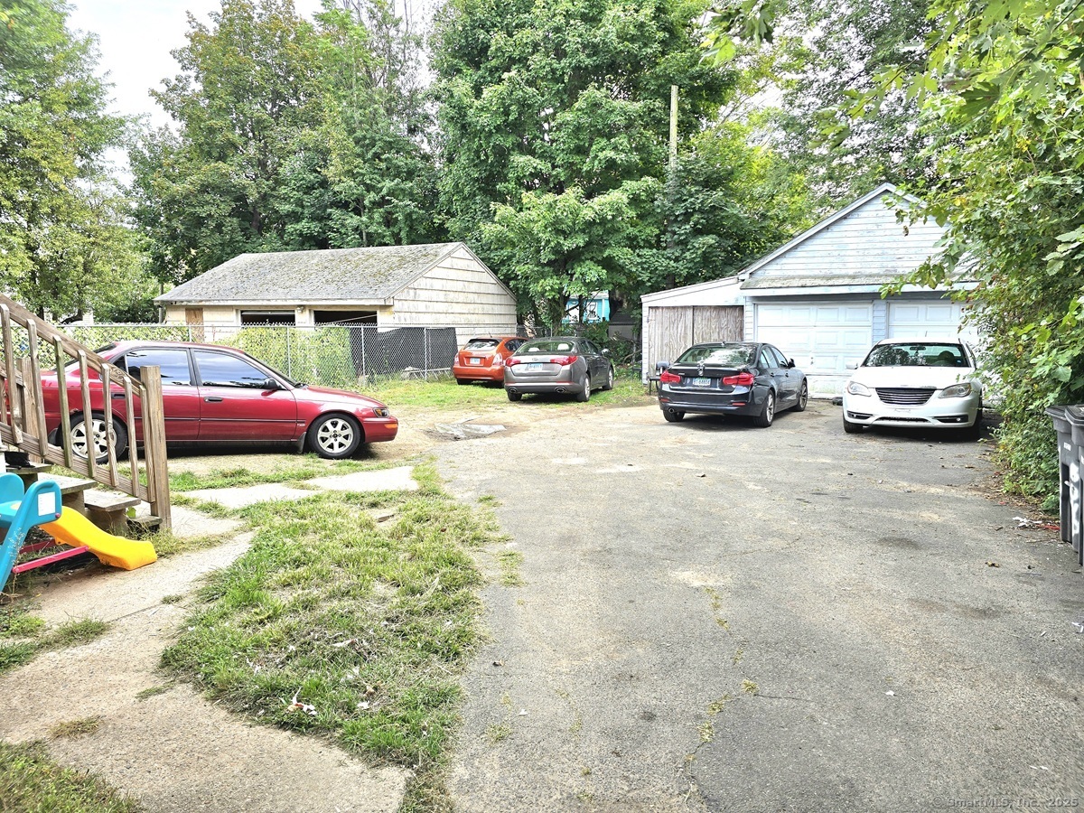 181 Bond Street, Unit 1 Hartford, CT 06114 - Photo 11 of 12 a view of a cars parked in front of a house