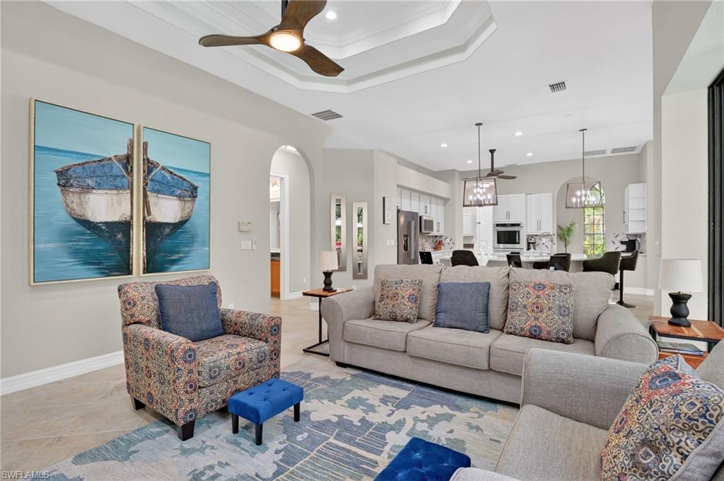2360 19th Street Southwest Naples, FL 34117 - Photo 10 of 43 a living room with furniture and a large window