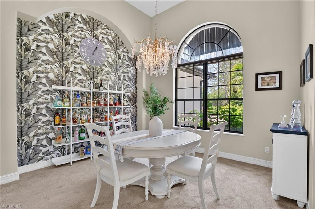 2360 19th Street Southwest Naples, FL 34117 - Photo 11 of 43 a view of a dining room with furniture and a window
