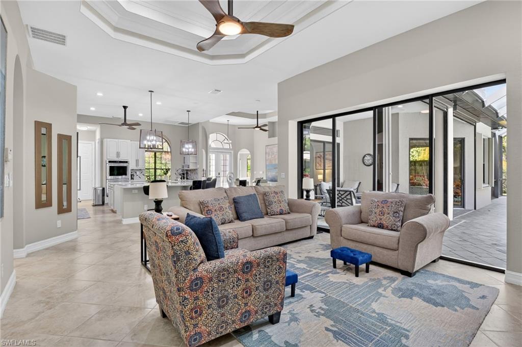 2360 19th Street Southwest Naples, FL 34117 - Photo 18 of 43 a living room with furniture and a large window