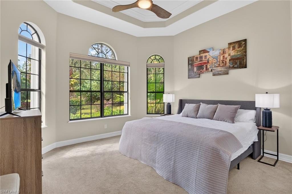 2360 19th Street Southwest Naples, FL 34117 - Photo 24 of 43 a spacious bedroom with a bed and a large window