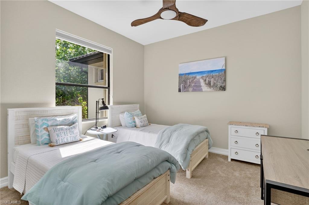 2360 19th Street Southwest Naples, FL 34117 - Photo 25 of 43 a bedroom with a bed and a painting on the wall