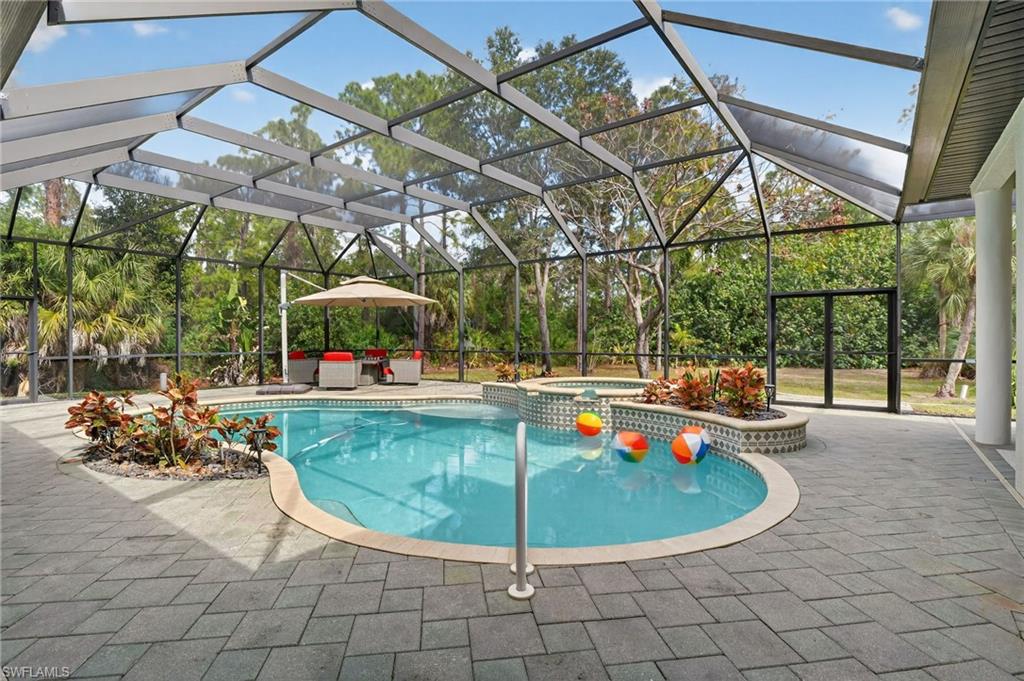 2360 19th Street Southwest Naples, FL 34117 - Photo 27 of 43 a view of a swimming pool with a patio
