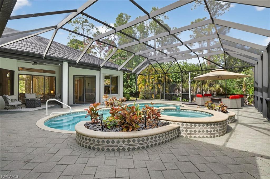 2360 19th Street Southwest Naples, FL 34117 - Photo 29 of 43 a view of a chairs and table in the patio