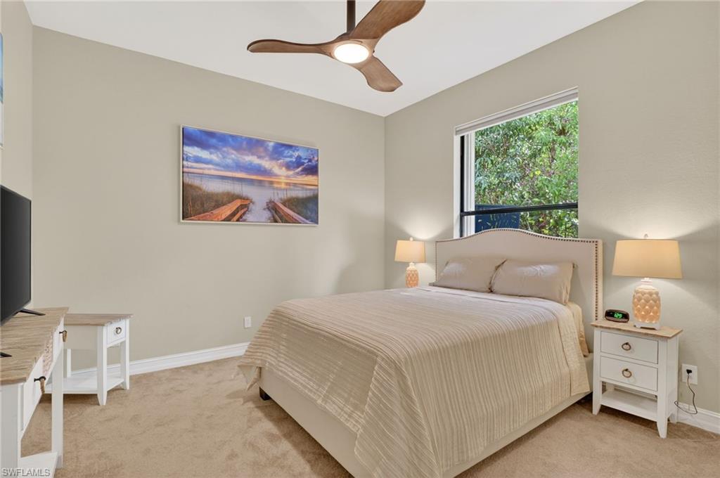 2360 19th Street Southwest Naples, FL 34117 - Photo 35 of 43 a room with a bed and a chandelier