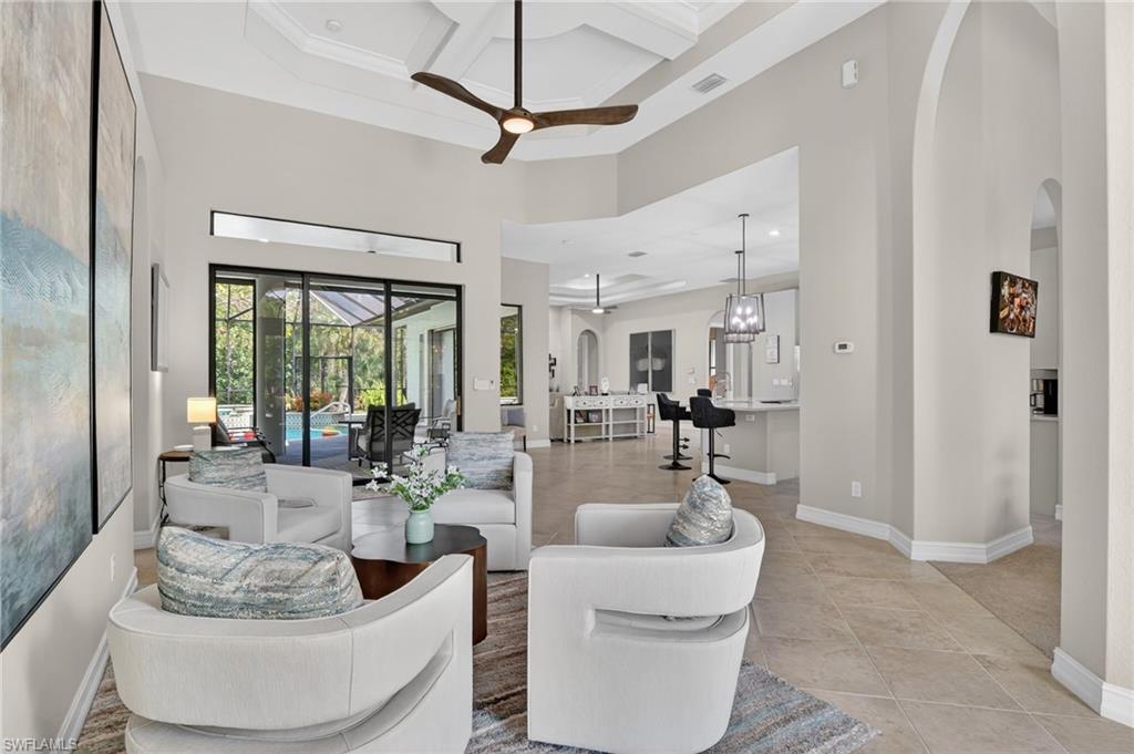 2360 19th Street Southwest Naples, FL 34117 - Photo 3 of 43 a living room with furniture and a large window
