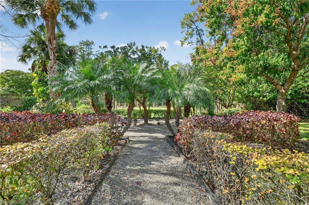 2360 19th Street Southwest Naples, FL 34117 - Photo 5 of 43 a pathway of a yard