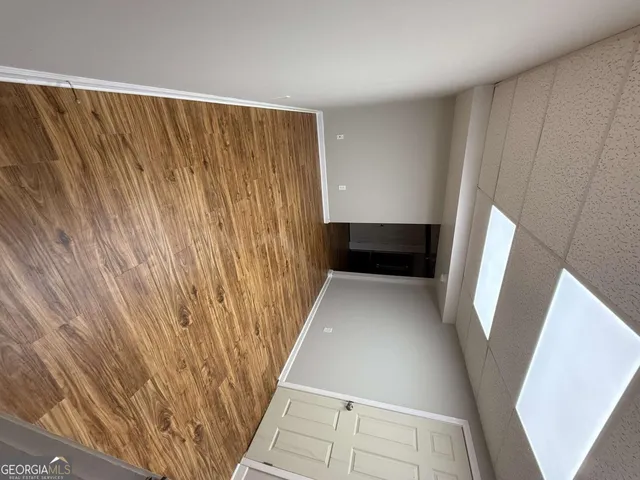 a view of entryway with stairs and wooden floor