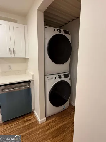 a view of a hallway with washer and dryer