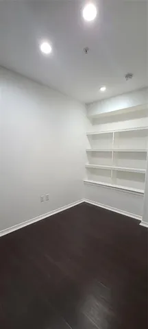 an empty room with wooden floor