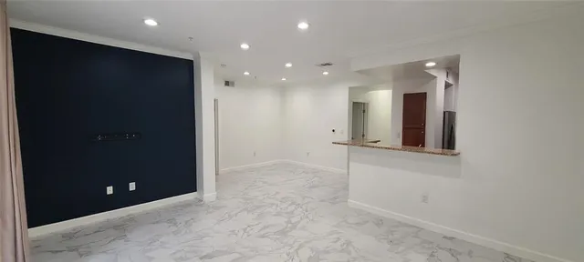 a room with a bed and furniture