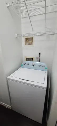 a kitchen with kitchen island granite countertop a sink stainless steel appliances and cabinets
