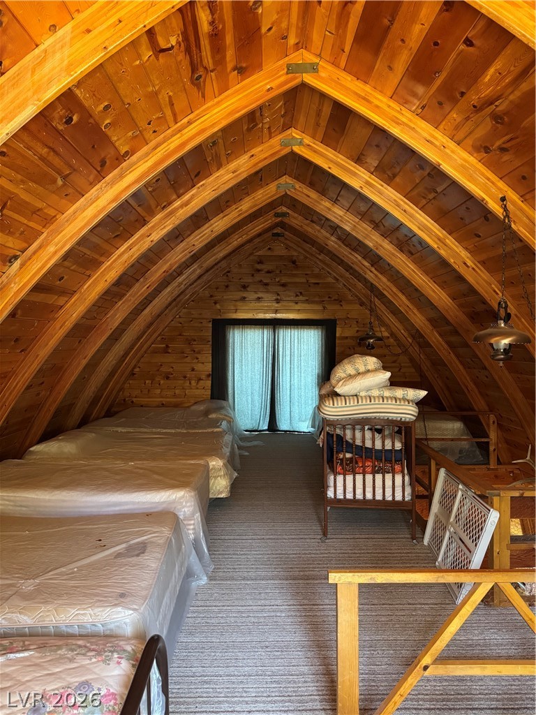 20996 Pinion Pine Road Pioche, NV 89043 - Photo 5 of 19 This cozy attic space boasts charming wood paneling and a functional window.