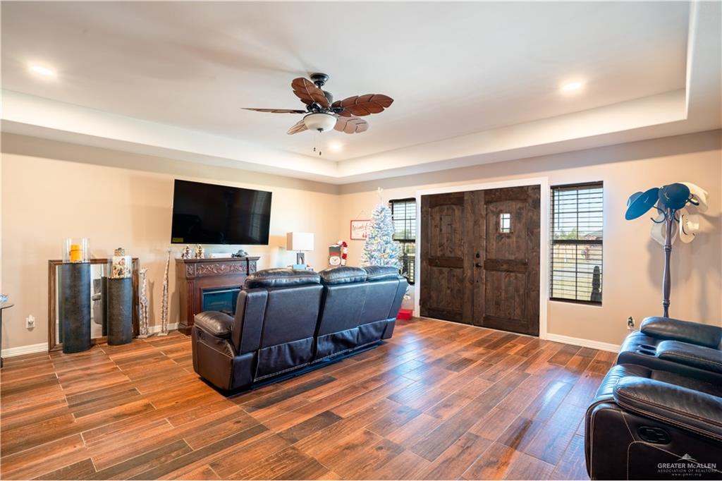 21604 North Val Verde Road Edinburg, TX 78542 - Photo 11 of 39 a living room with furniture and a flat screen tv