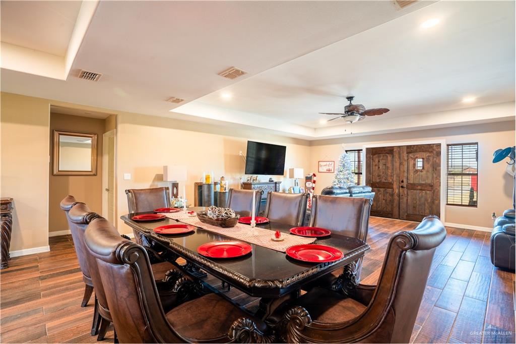 21604 North Val Verde Road Edinburg, TX 78542 - Photo 12 of 39 a view of a dining room with furniture window and wooden floor