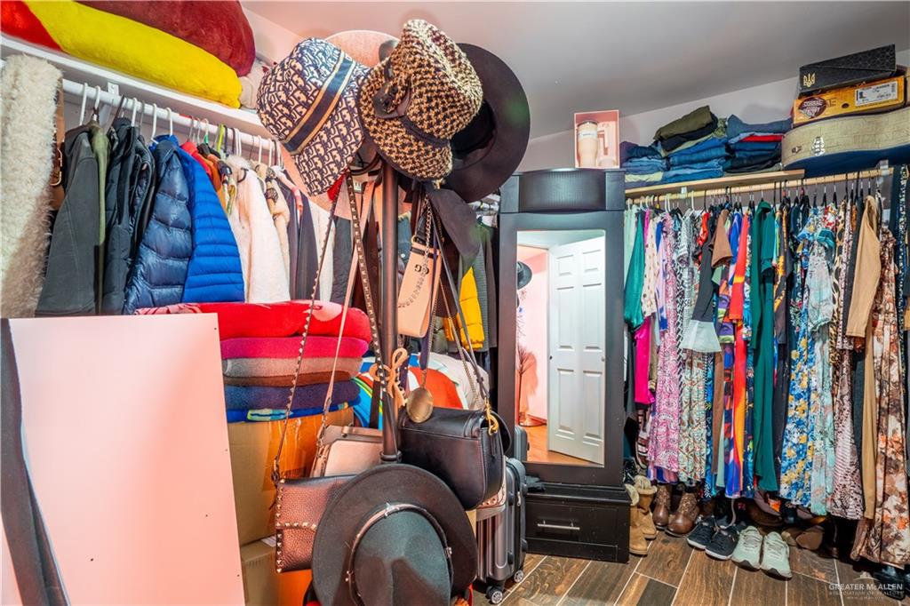 21604 North Val Verde Road Edinburg, TX 78542 - Photo 20 of 39 a view of walk in closet with clothes and shoes