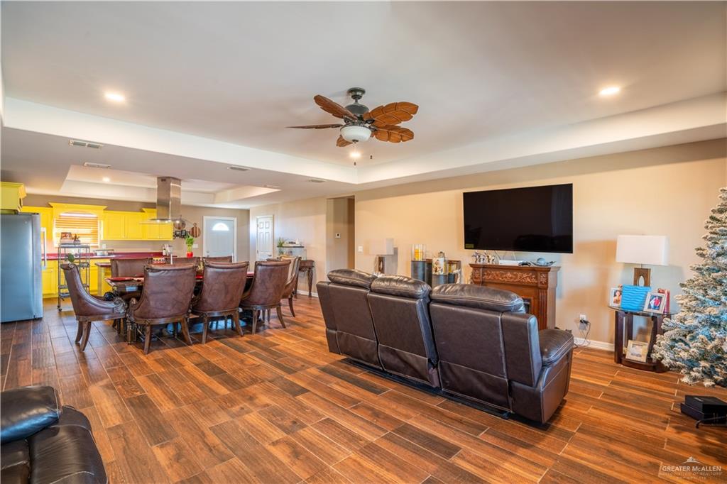 21604 North Val Verde Road Edinburg, TX 78542 - Photo 10 of 39 a living room with furniture and a flat screen tv