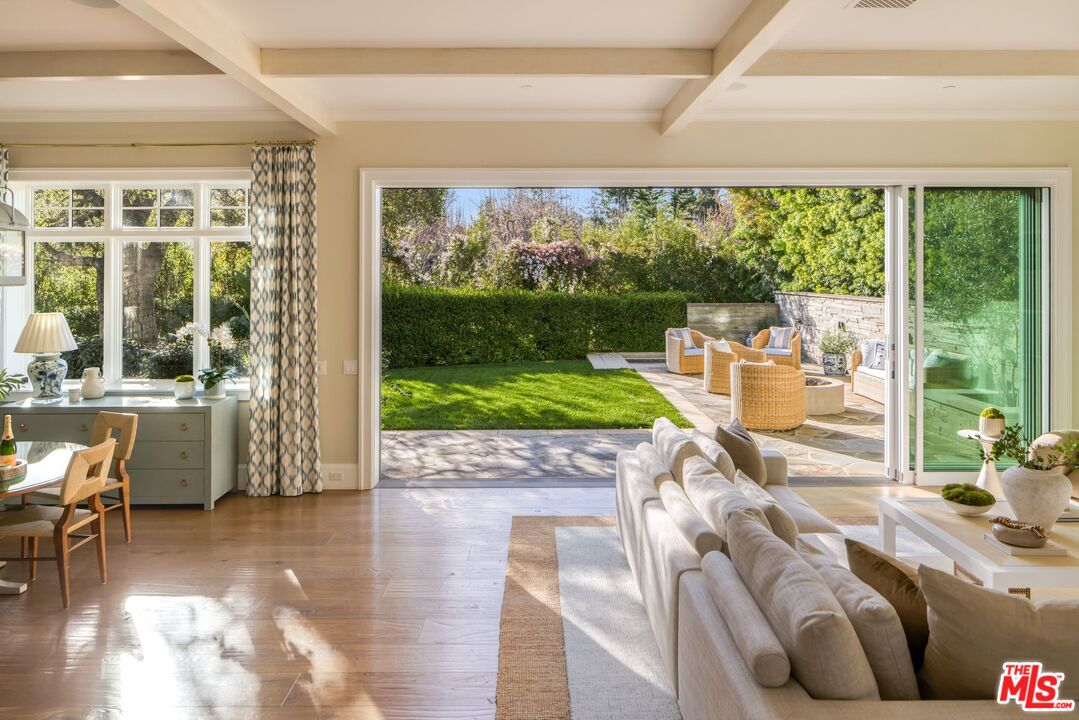 782 Ranch Lane Pacific Palisades, CA 90272 - Photo 11 of 53 a living room with a floor to ceiling window and pool table