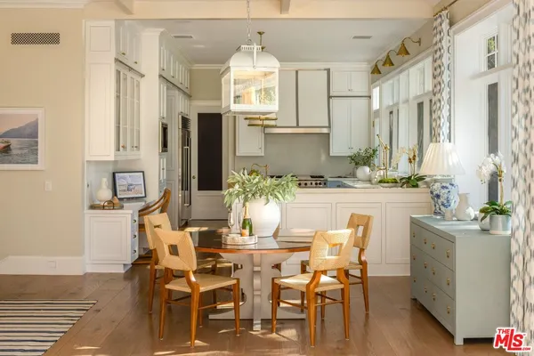 a dining room with furniture and window