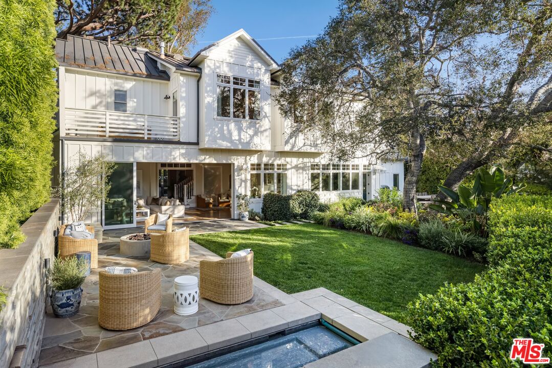 782 Ranch Lane Pacific Palisades, CA 90272 - Photo 2 of 53 a view of a house with backyard sitting area and garden