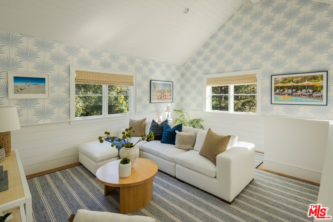 782 Ranch Lane Pacific Palisades, CA 90272 - Photo 30 of 53 a living room with furniture and a potted plant