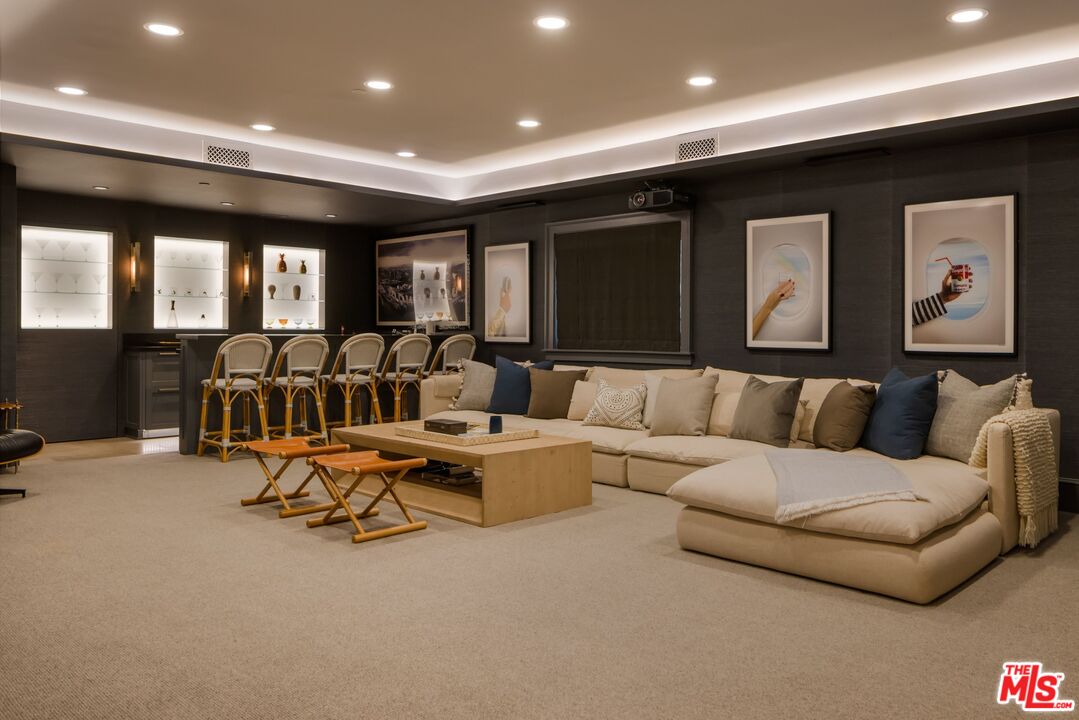 782 Ranch Lane Pacific Palisades, CA 90272 - Photo 33 of 53 a living room with furniture gym equipment and large windows